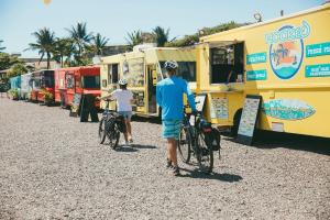 a group of people standing in front of a truck